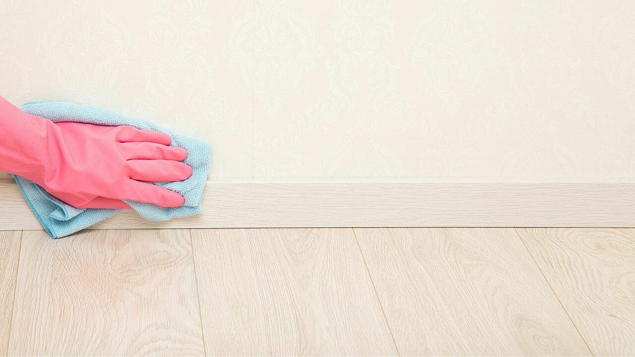 Clean baseboard and wall