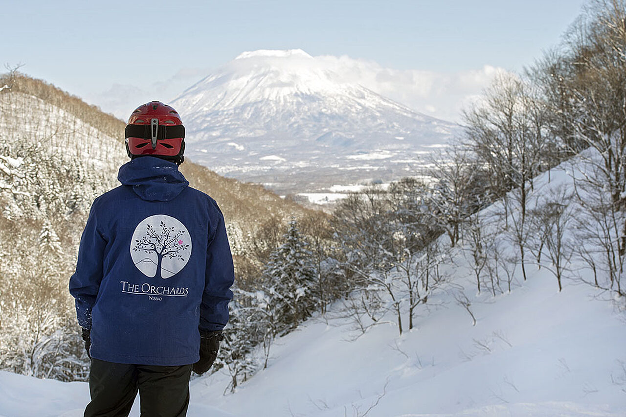 Eddie snow in The Orchards jacket with Mt Yotei 1