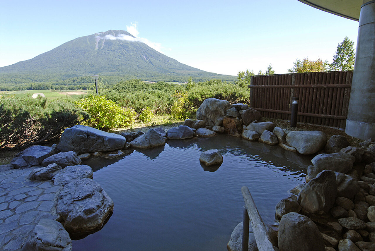 Makkari Onsen outdoor pool rotenburo mt yotei background